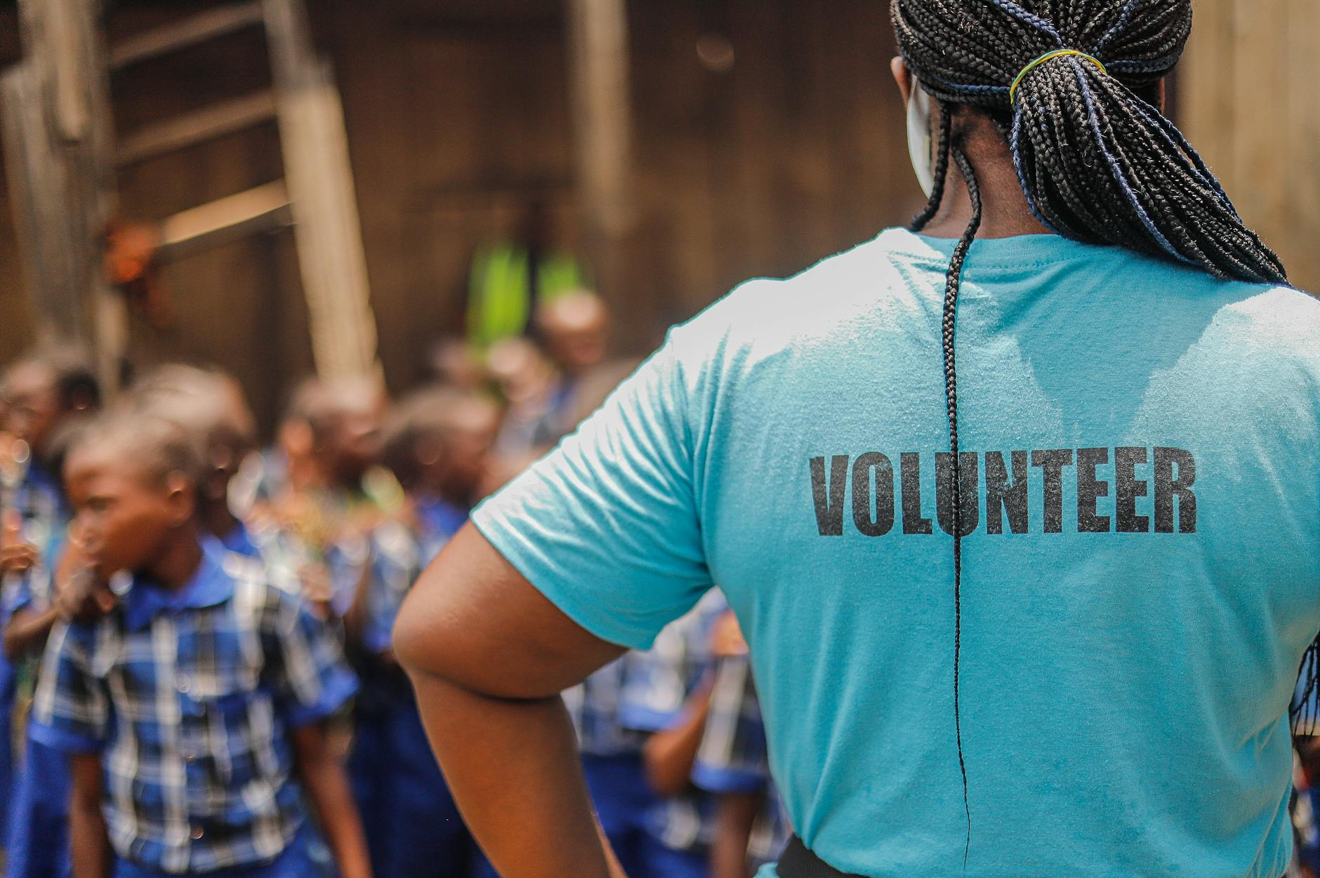 volunteer watching schoolboys